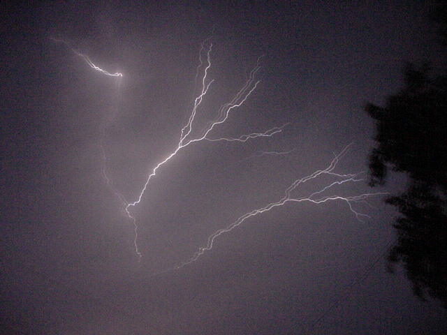 Lightning streaking across a night sky