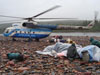 Researchers unload a helicopter.
