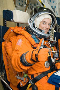 Stefanyshyn-Piper gives a thumbs-up in a shuttle simulator