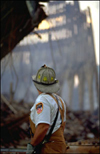 Photo of a firefighter looking at the New York crash site.