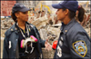 Photo of two female NYPD officers talking to one another at the World Trade Center.