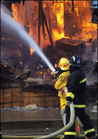 Firemen working on fire - Copyright WARNING: Not all materials on this Web site were created by the federal government. Some content — including both images and text — may be the copyrighted property of others and used by the DOL under a license. Such content generally is accompanied by a copyright notice. It is your responsibility to obtain any necessary permission from the owner's of such material prior to making use of it. You may contact the DOL for details on specific content, but we cannot guarantee the copyright status of such items. Please consult the U.S.Copyright Office at the Library of Congress — http://www.copyright.gov — to search for copyrighted materials.