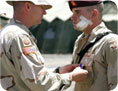 Wounded Service Man receiving a Purple Heart