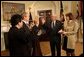 President George W. Bush presides over the swearing-in of William Donaldson as the new chairman of the Securities and Exchange Commission in the Roosevelt Room Tuesday, Feb. 18, 2003.  White House photo by Tina Hager