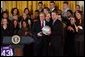 President George W. Bush poses with Andy Groom, captain of Ohio State University's football team, during a visit to the White House by the NCAA Fall Champions Monday, Feb. 24, 2003.   White House photo by Tina Hager