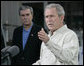 President George W. Bush gestures as he addresses his remarks prior to signing an Executive Order to protect the striped bass and red drum fish populations Saturday, Oct. 20, 2007, at the Chesapeake Bay Maritime Museum in St. Michaels, Md. U.S. Secretary of Commerce Carlos Gutierrez is seen background. White House photo by Eric Draper