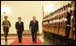 President George W. Bush and President Hu Jintao of the People's Republic of China, view Chinese troops during the welcome ceremonies for the President and Mrs. Bush at the Great Hall of People in Beijing.  White House photo by Eric Draper