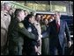 President George W. Bush meets with U.S. Customs and Border Protection officials following his address Monday, Nov. 28, 2005 at the Davis-Monthan Air Force Base in Tucson, Arizona, speaking on the importance of border security and the issue of immigration reform.  White House photo by Eric Draper