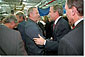 President George W. Bush wades into the crowd after speaking to Employees at the Dixie Printing Company in Glen Burnie, Md, Oct. 24. White House photo by Eric Draper.