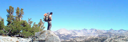 Backpacker gazing at peaks
