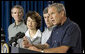 President George W. Bush addresses a news conference, Tuesday, Aug. 9, 2005 at the Bush Ranch in Crawford, Texas, following a meeting to discuss the strength of the U.S. economy. At left are economic policy advisors U.S. Trade Representative Rob Portman; U.S. Secretary of Labor Elaine Chao and U.S. Secretary of Agriculture Mike Johanns.  White House photo by Paul Morse