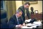  As pictured in the attached file photo, President George W. Bush works on a press statement with Principal Deputy White House Press Secretary Scott McClellan in the Oval Office Nov. 7, 2002. President Bush announced today that he will name Scott McClellan to be Assistant to the President and White House Press Secretary. Currently, Mr. McClellan is Deputy Assistant to the President and the Principal Deputy White House Press Secretary. He will succeed current White House Press Secretary Ari Fleischer, who has announced that he will depart the White House next month.  White House photo by Eric Draper