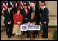 President George W. Bush signs H.R. 2669, the College Cost Reduction and Access Act, Thursday, September 27, 2007, in the Dwight D. Eisenhower Executive Office Building in Washington, D.C. The President is joined by Robert Garcia, a junior at the University of Texas, Laura Tappan, a sophomore at Northern Virginia Community College, Kalise Robinson, a junior at the University of the District of Columbia, Margie Clark, a student at Lord Fairfax Community College, Congressman Ric Keller of Florida, Congressman George Miller of California, Congressman John Spratt of South Carolina, and Secretary of Education Margaret Spellings. White House photo by Chris Greenberg