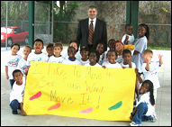 Photo: Frank Hibbard, mayor of Clearwater Florida, a PHC site, poses with local youth at one of several family wellness events held around the city. Photo by Y-USA