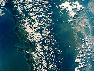Color photograph of the west coast of Burma, taken by L.G. Cooper during the MA-9 mission.
