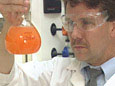 Man Examining Beaker