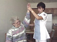 Nurse Exercising Elderly Patient