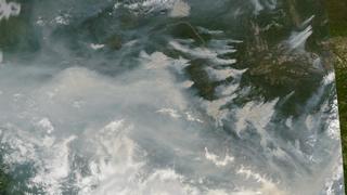 A closer look shows the individual smoke plumes. Date 2004-06-29