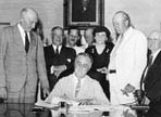 President Roosevelt signing Social Security Act--August 14, 1935