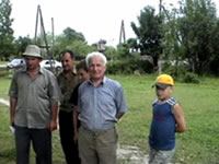 Abasha resident Shota Shalamberidze (center) has no problem sharing electricity with his village neighbors
