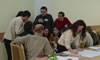 Members debate the primary goals of the Federation of Moldovan Legal Clinics