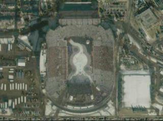 A seamless zoom from the Rice-Eccles Olympic Stadium on the ground to space ending with a spin of the Earth, using data from Terra-MODIS, Landsat-ETM+, and IKONOS