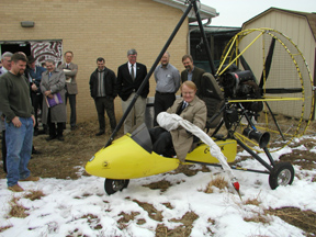 Deputy Assistant Secretary Tom Weimer tries out one of the ultralight aircraft used in the Whooping Crane Migration project