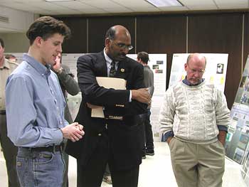 Maryland Lt Governor Mike Steele (center) watches a video and discusses Seaduck Research with Edward Lohnes (left) and Dr Matthew C Perry (right).