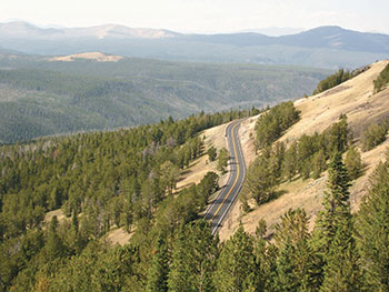 The Surface Transportation Assistance Act of 1982 ensured that funding was available to build roads on public lands, such as the scenic road in this aerial shot in Yellowstone National Park.