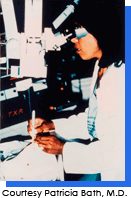Patricia E. Bath, M.D. inserting fiber optic into human eye, testing fragment, performing cataract surgery on human eyeball at the Laser Medical Center, Berlin West Germany, 1986. Courtesy Patricia E. Bath, M.D