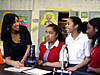 Shakira Brown talking with three teenage girls in a classroom
