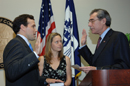 Secretary Gutierrez performs swearing in of David McCormick while Mrs. McCormick holds bible