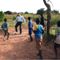 Photo of DCM Michael Koplovsky playing soccer with Zambian kids.