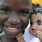 Photo of a Zambian girl with a doll.