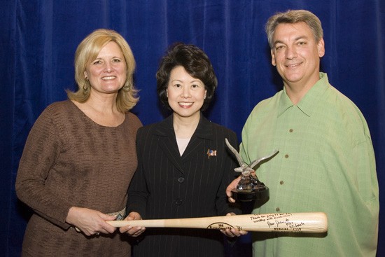 Former Major League Baseball Pitcher and Secretary SPIRIT Award recipient Dave Dravecky with wife, Jan, (left) presents autographed bat to Secretary of Labor Elaine L. Chao. (DOL photo/Shawn Moore)
