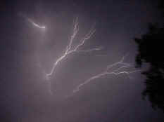 Lightning streaks across the sky at night