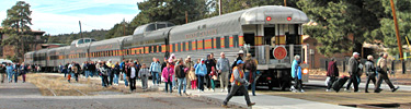 Passengers getting off train at historic depot