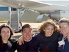 Picture of students in front of airplane.