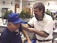 Nurse Assisting Elderly Man