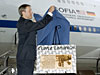 Erik Lindbergh, grandson of Charles Lindbergh, unveils a plaque rededicating NASA's SOFIA aircraft as 
