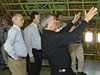 Dietmar Lilienthal (foreground, gesturing), German program manager for the SOFIA, points out a feature of the NASA 747SP to a group of German dignitaries.