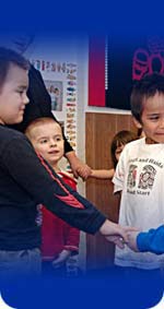 Photo of children holding hands