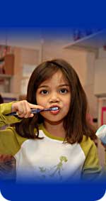 Photo of a girl brushing her teeth