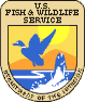 Fish and Wildlife Service emblem depicting a flying duck and a fish coming out of water