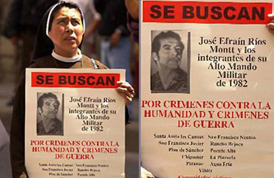 In front of the public ministry in Guatemala City, Guatemala, a nun carries a poster showing a photo of Guatemalan dictator Efrain Rios Montt. The text reads 