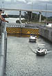 photo of boats traveling through lock