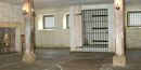 Interior of jail cell with box for prisoners to visit with their lawyers