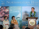 Deputy Commerce Secretary David A. Sampson makes remarks at the ceremony unveiling the native name of the Northwestern Hawaiian Islands Marine National Monument while Hawaii governor Linda Lingle (center) and First Lady Laura Bush (left) look on