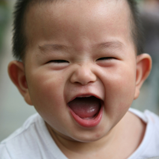 baby smiling activates mom's reward centers in brain
