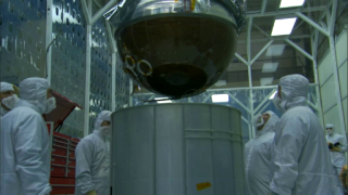 <b>PROPULSION TANK INTEGRATION</b> <br />
SDO's Propulsion Tank, with pyro-technic valves, will send fuel to various thrusters on the observatory's main engine for launch.
<p>For complete transcription of this video, please click <a href='proptankinteg.html'>here</a>. 